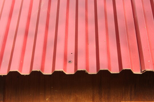 Red corrugated metal sheets background texture