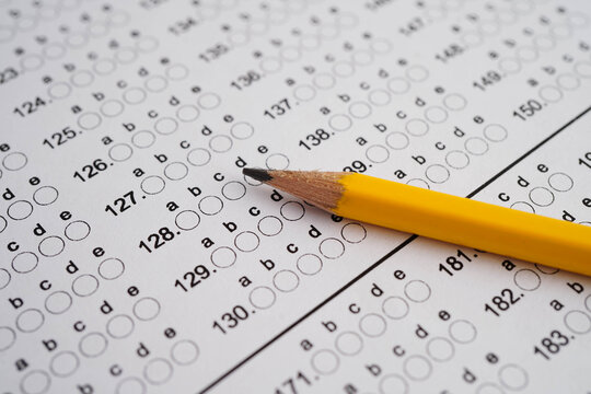 Answer sheets with pencil drawing fill to select choice, education concept.