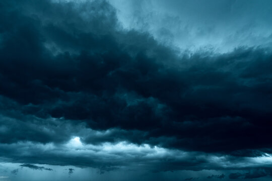 Dark dramatic sky and clouds. Background for death and sad concept. Gray sky and fluffy white clouds. Thunder and storm sky. Sad and moody sky. Nature background. Dead abstract background. Cloudscape.