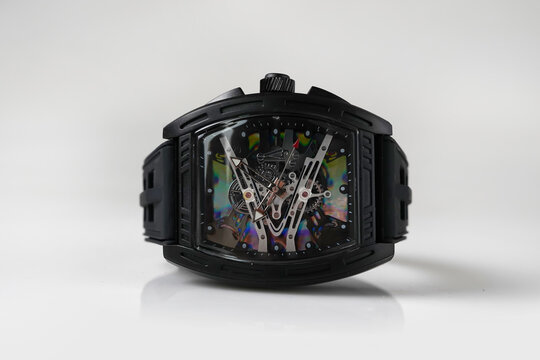 Black Skeleton Wristwatch with Tonneau Case on White Background