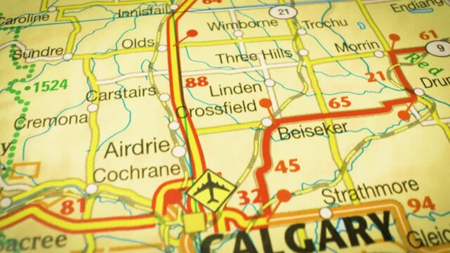 network of roads leading to Calgary, Canada &ndash; gliding view over an atlas map