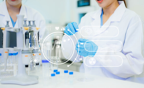 Scientists in a modern lab conduct chemical experiments, surrounded by futuristic digital medical icons, symbolizing biotech innovation