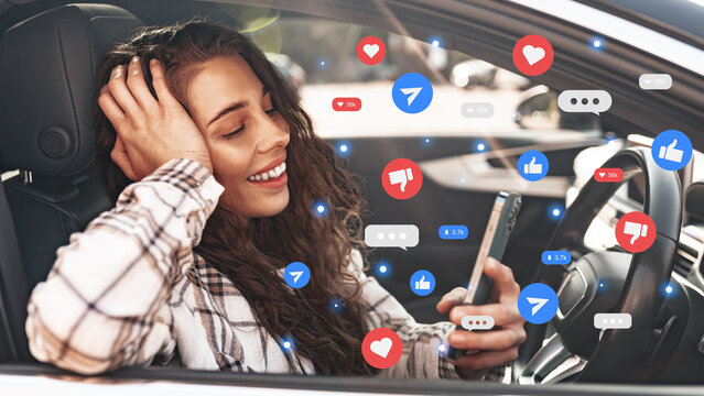 Person using a smartphone to check social media chats and calls while sitting in a car