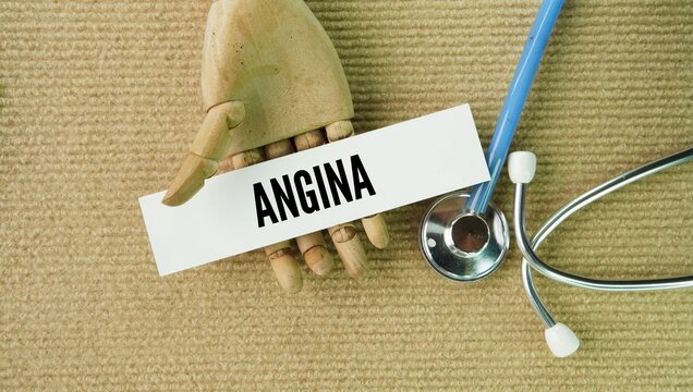 Stethoscope, glasses and a paper tag with the word Angina. type of chest pain or discomfort that happens when your heart muscle does not get enough oxygen-rich blood.