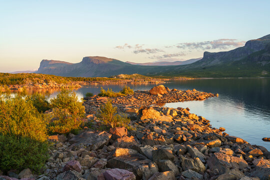 Stora Lulevatten lake and mountain at sunset