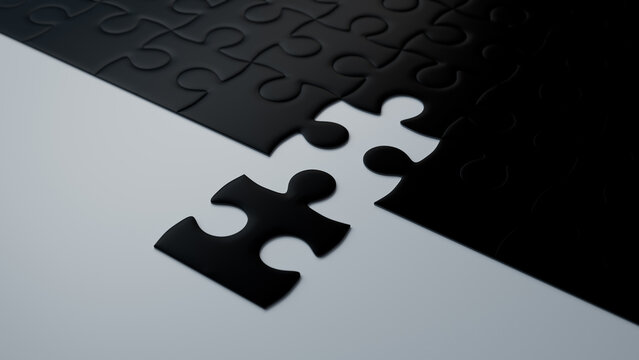 Close up of Black Jigsaw Puzzle texture Backdrop with final piece moving into place. Solution Concept.