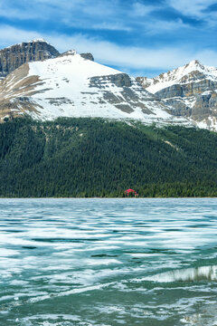 Frozen Bow Lake with lodge and Canadian Rockies mountains