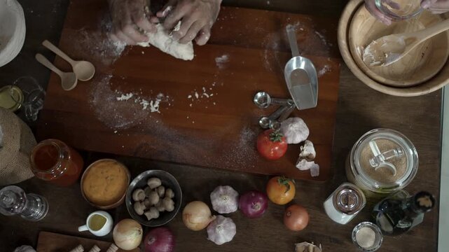 Overhead View of Hands Kneading Pizza Dough