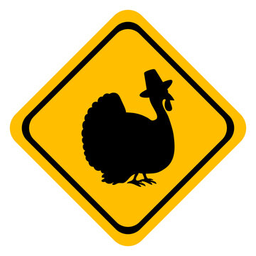 Turkey logo. D&iacute;a de Acci&oacute;n de Gracia. Icono con dibujo sencillo de una se&ntilde;al con forma de diamante de color amarillo con la silueta de un pavo con un sombrero de peregrino 