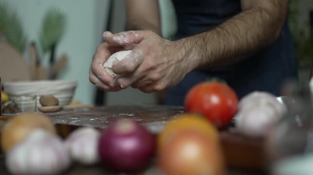 Hands Cup and Round a Ball of Pizza Dough