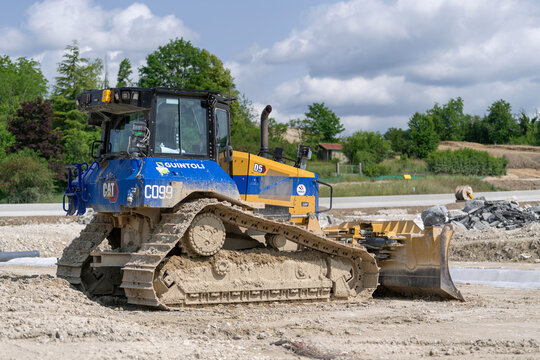 Ligny-en-Barrois, France - June 9th 2025 : View on a yellow and blue bulldozer CAT D5 for earthworks on a construction site.