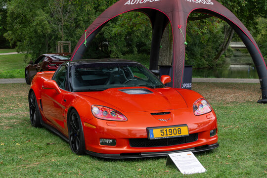 Mondorf-les-Bains, Luxembourg - September 13th 2026 : View on an orange Chevrolet Corvette C6 ZR1 parked on a lawn.