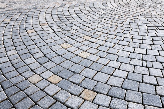 High angle view of a historic European cobblestone pavement with fan pattern