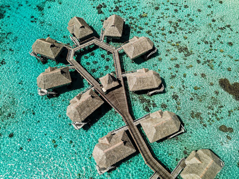 FRENCH POLYNESIA. MOOREA ISLAND. AERIAL VIEW OF THE SOFITEL KIA ORA HOTEL, BUNGALOWS ON STILTS