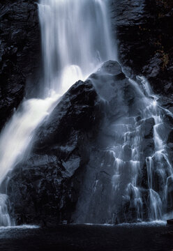 Scenic waterfall flowing over rock formations