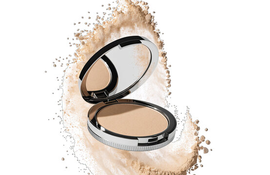 Compact powder case is opened and displays makeup product. Fine powder is scattered around the case highlighting its makeup purpose