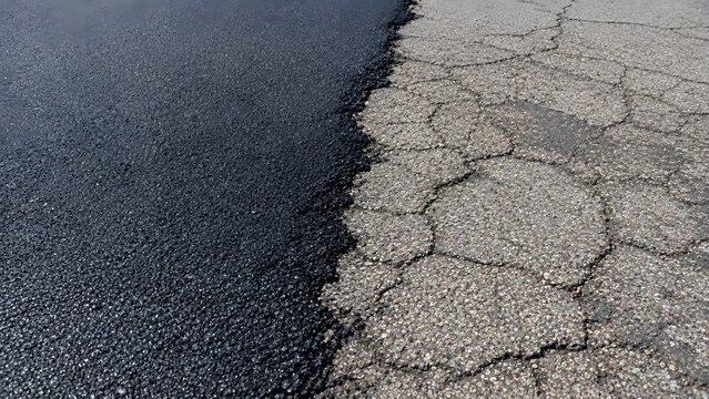 Fresh Asphalt Overlay Beside Cracked Old Pavement
