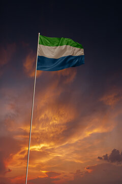 National flag of Sierra Leone in evening sky for holiday card design