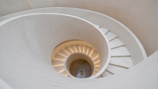 Elegant Spiral Staircase with Soft Lighting in Modern Architecture