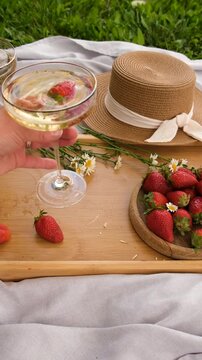 Picnic with strawberries and wine. Selective focus.