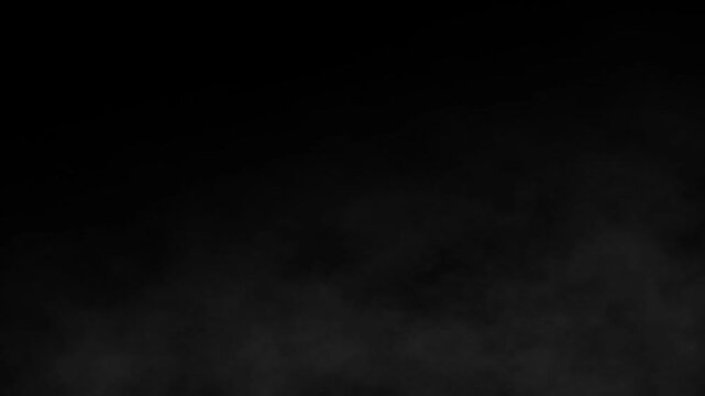 Dark smoke flows and shifts across a black background, showcasing a dynamic interplay of light and shadow, with gradual changes in density and texture that evoke a sense of mystery and depth