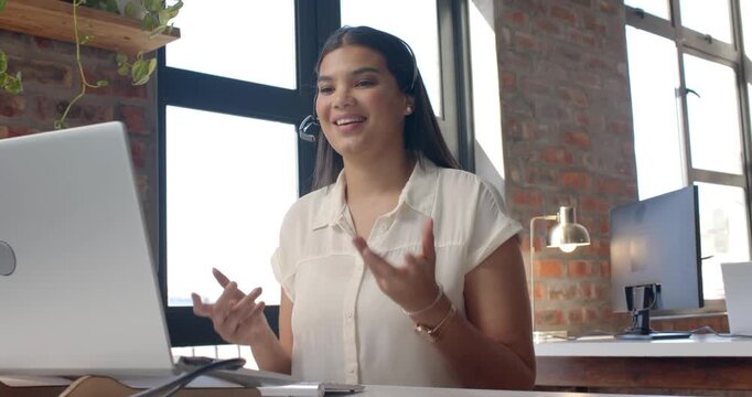 Lifestyle videos indoor of people doing activities at office, woman wearing headset during video cal