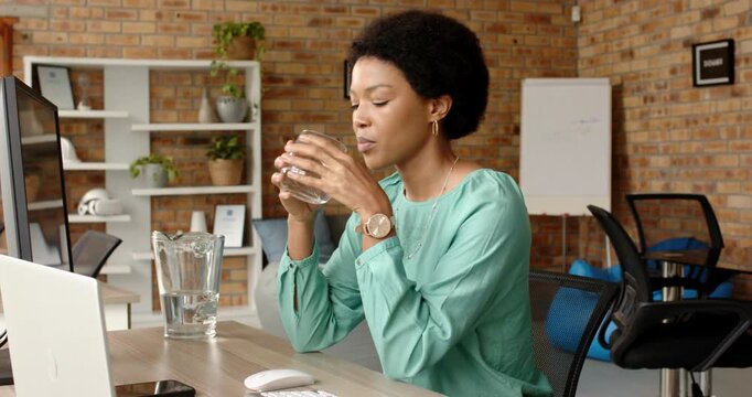 Lifestyle videos indoor of people doing activities at office, drinking water, woman taking break fro