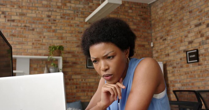 Lifestyle videos indoor of people doing activities at office, working on laptop, woman in blue top f