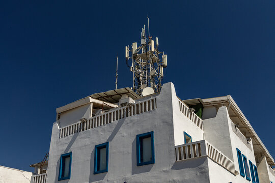 5G antenna on a city building illustrating electromagnetic radiation concerns
