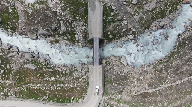 Car passing over the river in Keylong, Lahaul, Himachal Pradesh
