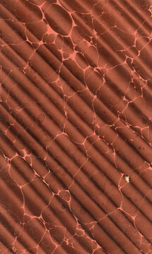 Historic hand-marbled book endpaper with diagonal brown texture (Wellenmarmorpapier)