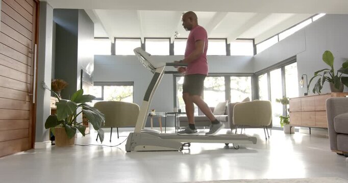 Lifestyle videos indoor of people doing activities at home, exercising on treadmill, man in living r
