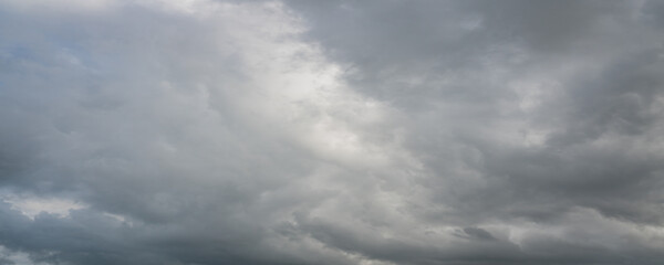 Obraz premium Dramatic Gray Storm Clouds with Blue Sky