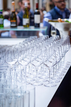 Glasses lined up at a bar