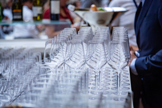 Glasses lined up at a bar