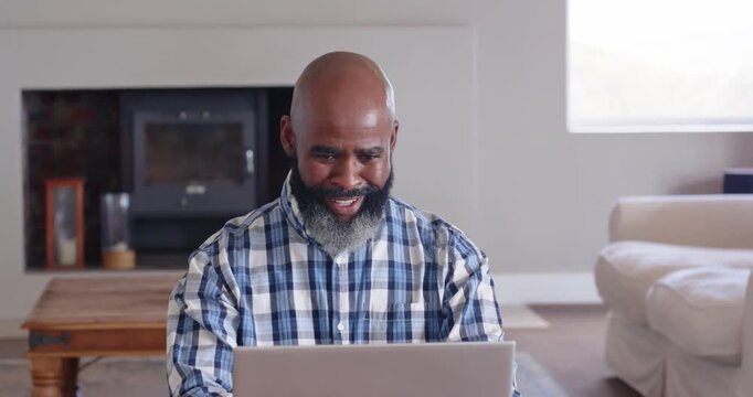 Lifestyle videos indoor of people doing activities at home, Smiling man using laptop at home, celebr