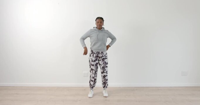 High speed photography for dynamic scenes, Dancing joyfully, woman in casual outfit enjoying her tim