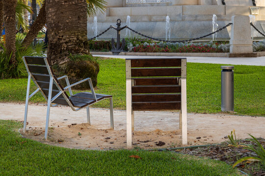 park benches near monument and fountain