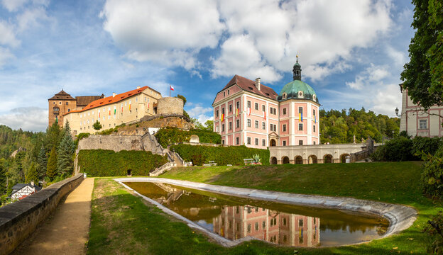Becov nad Teplou Castle and Chateau with a garden and pond reflecting the historical architecture on a sunny day, Becov nad Teplou, Czech Republic