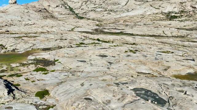 Drone flight over granite massif near Lake Balkhash, Bektau-Ata mountain, 4K aerial footage 