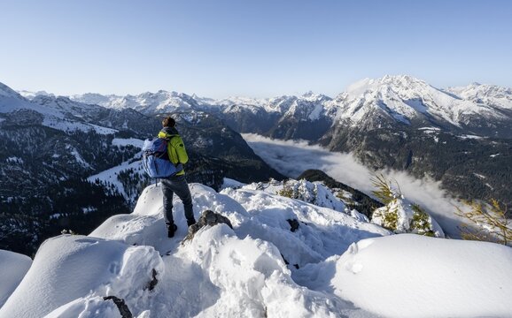 Mountaineers on the snowy summit of the Jenner in autumn, view of the sea of clouds and the Watzmann, Berchtesgaden National Park, Berchtesgaden Alps, Sch&ouml;nau am K&ouml;nigssee, Berchtesgadener Land, Bavaria, Germany
