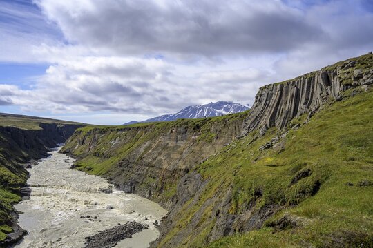 J&ouml;kulsa i Flj&oacute;tsdal with basalt rocks and Sn&auml;fell in the background, waterfall round Laugafellh&uuml;tte, Flj&oacute;tsdalur, Austurland, Iceland