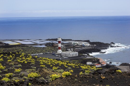 Coastline with Tenegu&iacute;a saltworks, old and new lighthouse, south cape Punta de Fuencaliente, La Palma, Canary Islands, Spain