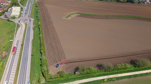 Tractor Ploughing Arable Farmland for Crop Sowing Yorkshire Drone View