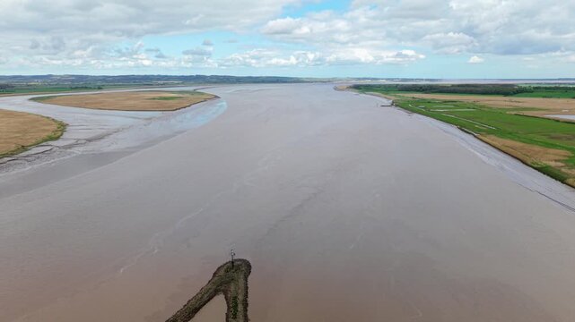 Top Down Aerial View of Swirling Currents at River Confluence in England