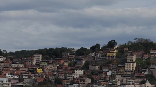 Dense Hillside Housing Under Overcast Urban Sky