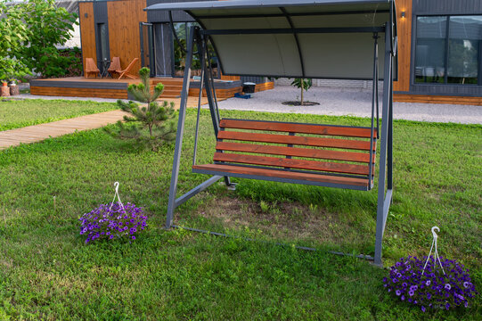Garden swing, gazebo near the house for relaxing on the lawn. Sided house and country getaway; rentals available.