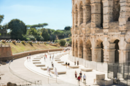 Blurred photo of Coliseum in Rome during a sunny day - Travel, vacation and history concept - Defocused image - UGC content