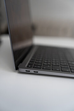 Dark Workspace with Laptop Close-Up