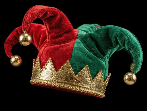 Jester hat with red and green velvet fabric and golden crown detail rests on black background. Bells attached to hat points jingle merrily, adding festive cheer for celebrations.